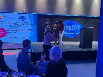 Award ceremony on stage at ISBE 2025